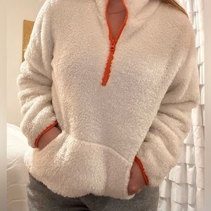 orange and white sherpa fuzzy long sleeve sweater quart zip winter